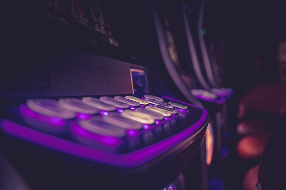 gambling machine buttons illuminated in purple