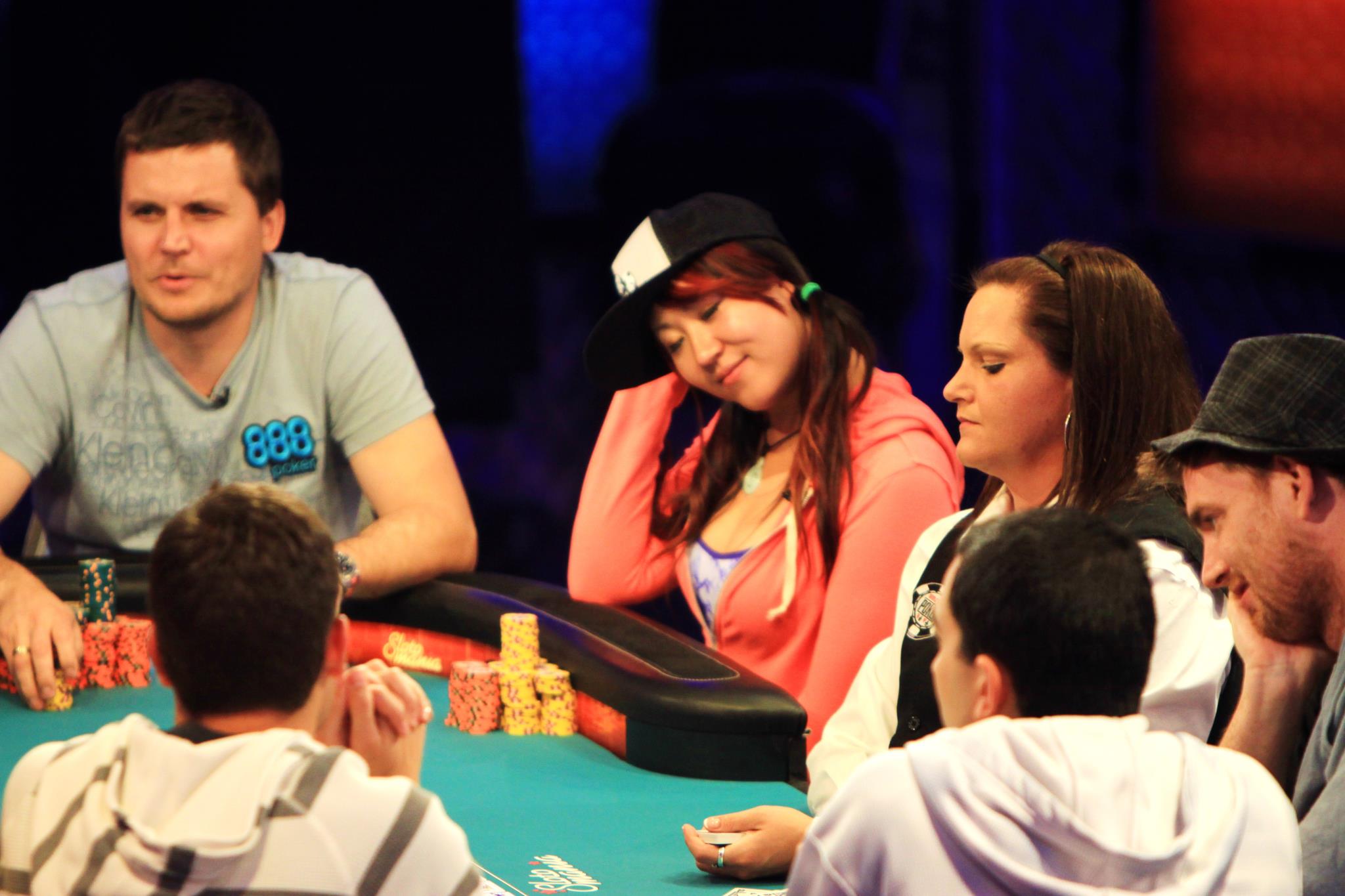 Poker pro Susie Zhao at a poker table with other players